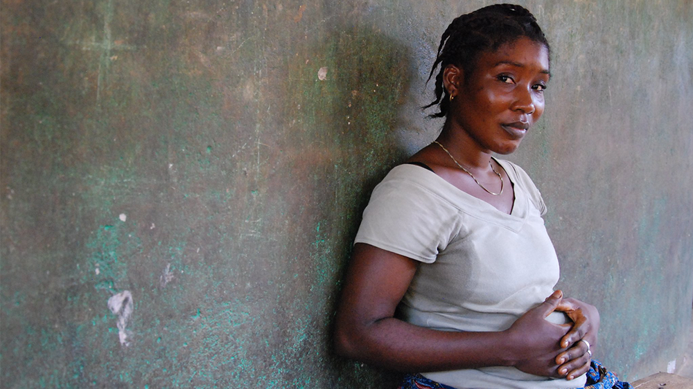 Pregnant woman holding her stomach