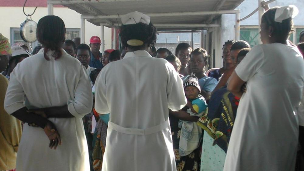 medical staff greeting a large group of patients