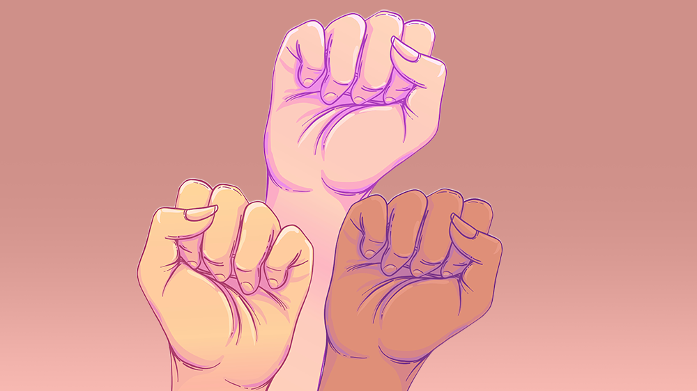 Yellow, white and black fists in the air