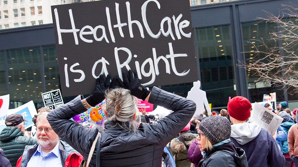 Woman holding sign 